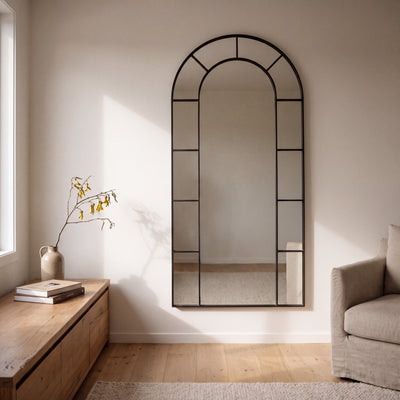 Bastia X black arched window full length mirror 200 x 100cm hanging on a living room wall in morning light