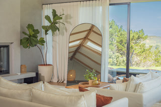 Grandeur Arched 2.0m Full-Length Mirror in a bright living room with elegant furnishings and a lush green outdoor view | C&F Creation.