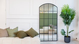 Le Beau 190x90cm arched window full-length mirror by C&F Creation, styled as a floor mirror in a bright living room with neutral tones and indoor greenery.