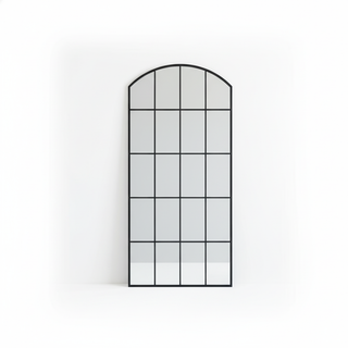 Decorative wall mirror with a grid design on a white background
