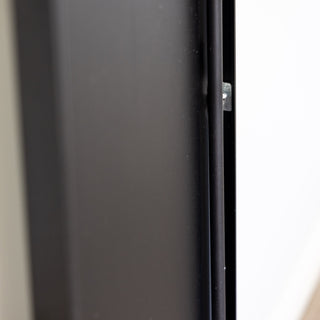 A close-up view of the Lithe X Full-Length Mirror’s sleek black aluminium alloy frame with reinforced mounting hardware for durability and stability. Ideal for freestanding, wall-mounted, or floor use. | C&F Creation