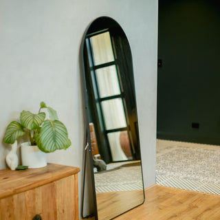 Titan Arched 180x80 Full-Length Mirror in a freestanding position, featuring a sturdy black aluminium alloy frame in a contemporary setting | C&F Creation