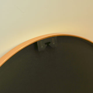 Close-up of the back hook detail on the Valor Round Wall Mirror with a gold aluminium alloy frame, showcasing secure mounting design | C&F Creation