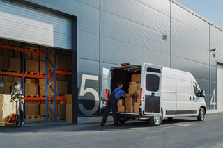 C&F Creation full-length mirror being carefully loaded into a New Zealand Couriers delivery van