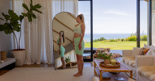 Full length mirror NZ buying guide 2026 - checking an outfit in a C&F Creation arched full length mirror in a coastal NZ living room
