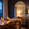 Bastia Aurelia antique gold arched window full length mirror 200 x 100cm in a candlelit dining room at dusk