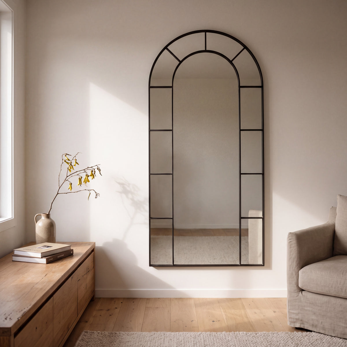 Bastia X black arched window full length mirror 200 x 100cm hanging on a living room wall in morning light