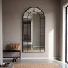 Bastia X black arched window full length mirror 200 x 100cm above an entry bench on a microcement wall