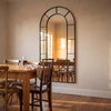 Bastia X black arched window full length mirror 200 x 100cm in a dining corner at golden hour
