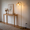 Camille Amber Petal Glass Floor Lamp brightening a stylish entryway beside an oak console