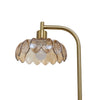 Close up of the Camille Amber Petal Glass Floor Lamp amber pressed glass petal shade and brushed gold arm