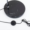 Close up of the Cosmo Chrome Marble Base Floor Lamp round black marble base with power cord and inline foot switch