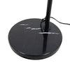 Close up of the Flore Black Arc Floor Lamp round black marble base with natural white veining and cable