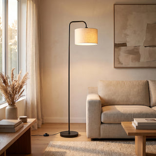 Marceau Linen Drum Floor Lamp glowing warm beside a sofa in a New Zealand living room at night