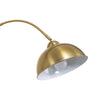 Close up of the Orsay Gold Arc Floor Lamp dome shade where it meets the curved gold arm