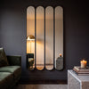 Ravel quad oval black cast iron full length mirror 200 x 100cm in a lounge at evening