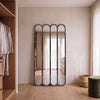 Ravel quad oval black cast iron full length mirror 200 x 100cm leaning against a dressing room wall