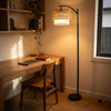 Rousseau Rattan Weave Floor Lamp brightening a quiet study nook beside the desk