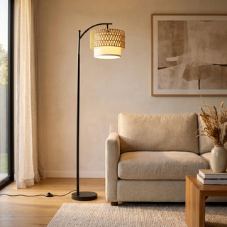 Rousseau Rattan Weave Floor Lamp standing beside a sofa in a bright New Zealand living room