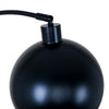 Close up of the Saturne Black Globe Arc Floor Lamp globe shade from above at the tip of the arc