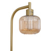 Close up of the Solara Fluted Lantern Floor Lamp brass E27 lamp holder and fluted amber glass shade on white background