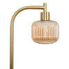 Close up of the Solara Fluted Lantern Floor Lamp ribbed amber glass shade hanging from the curved brass arm, on white background