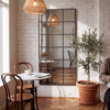 Tivoli X black rectangular window full length mirror 200 x 100cm in a cafe corner against white brick