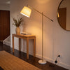 Vienna Brass Marble Base Floor Lamp in an entry hallway beside an oak console