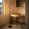 Voltaire 3-Light Cage Floor Lamp standing beside a desk in a home study nook