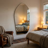 C&F Creation Cascade X Irregular Frameless Full Length Mirror 200x100cm in New Zealand bedroom setting with natural light