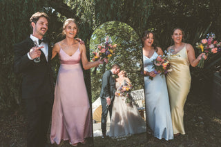 Wedding party with bride and groom in the background
