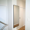 The Facet full-length wall mirror 170x70cm installed in a hallway, enhancing the space with its modern design.