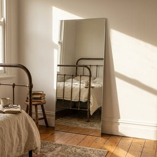 C&F Creation Gabriel Frameless Rectangular Full Length Mirror 180x80cm leaning in villa bedroom with natural light