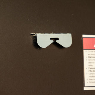 Close-up view of the Grandeur X arched mirror’s wall-mounting hook on the back panel, showing the pre-installed metal bracket for secure hanging. The image highlights the precision cut-out design and sturdy attachment point, ensuring safe and easy installation for wall-mounted setups.