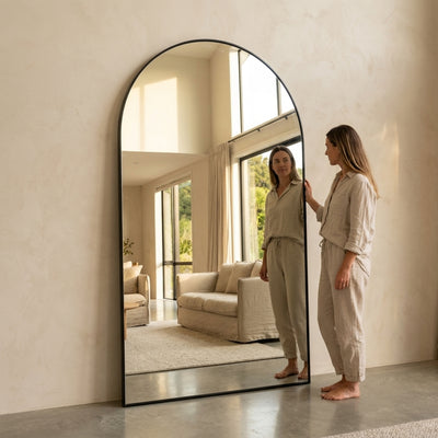 C&F Creation Louis Arched Full Length Mirror 220x120cm leaning in grand living room with person showing massive 220cm scale