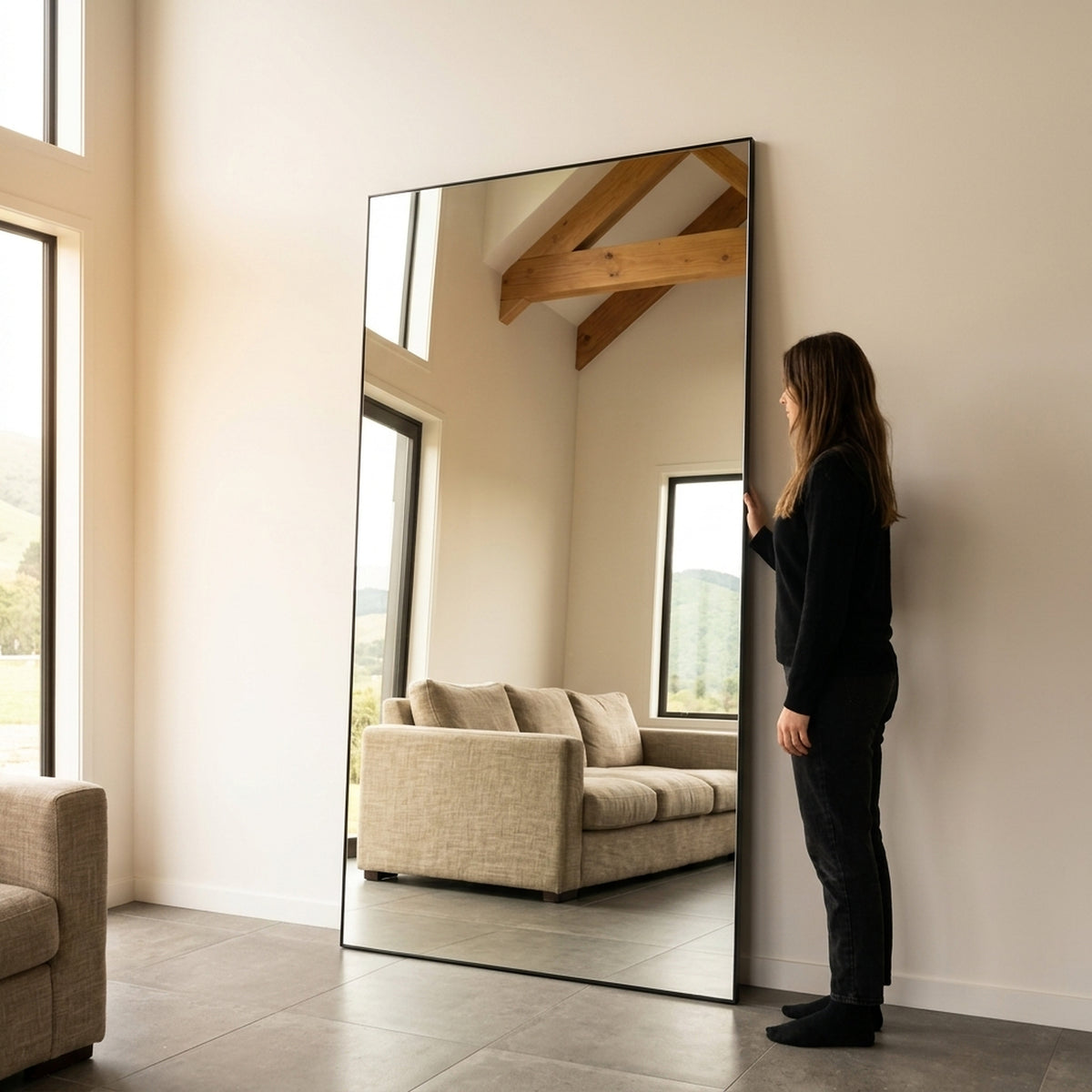 C&F Creation Lowen X Rectangular Full Length Mirror 220x120cm leaning in living room with person showing massive 220cm scale