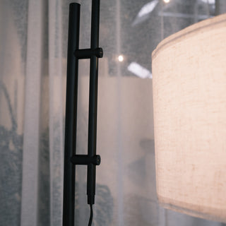 Close up of the Madox Loft floor lamp’s adjustable black metal arm beside the warm fabric shade, showing the modern minimalist design. Ideal for floor lamps NZ, standing lamps, modern floor lamps and dimmable lamps. | C&F Creation NZ