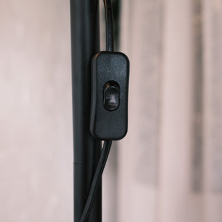 Close up of the Madox Loft floor lamp’s inline black switch on the metal stand, shown in a soft modern interior setting. Perfect for floor lamps NZ, standing lamps, modern floor lamps and dimmable lamps. | C&F Creation NZ