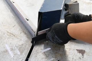 Worker performing precise cutting of an aluminium alloy frame for a full-length mirror at the C&F Creations factory.