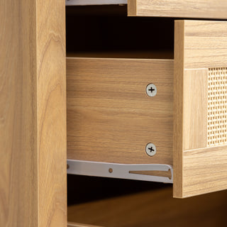 Close-up of the Raya 6 Drawer dresser showing the side of an open drawer with smooth metal runners, oak wood finish, and rattan panel front, highlighting build quality and ease of use.