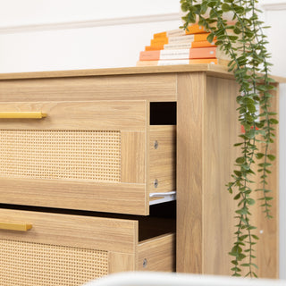 Detailed close-up of the Raya 6-Drawer Lowboy in oak finish, showing the drawer runner mechanism, cane-style drawer front, and smooth sliding design.