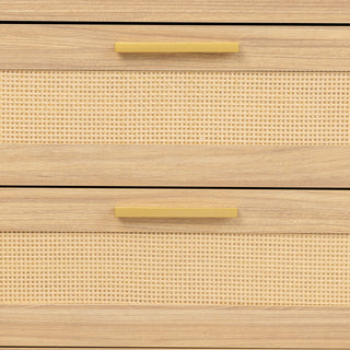 Front view close-up of two drawers on the Raya 6 Drawer dresser, featuring woven rattan panels framed in oak wood, accented by slim brass handles for a natural yet refined look.
