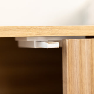 Detail view of the Renne shoe cabinet’s magnetic door hanger, ensuring the cabinet doors stay securely closed. The oak finish design combines functionality with clean lines, offering reliable storage and a modern look for New Zealand homes.