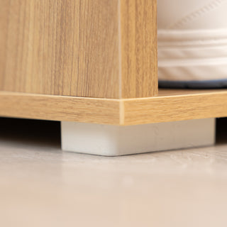 Close-up view of the Renne Shoe Cabinet bottom support with sturdy white base detail, showcasing stability and oak wood finish.