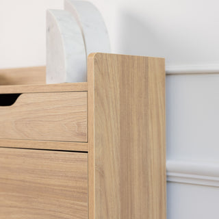 Side profile of the Risa Slim Shoe Cabinet highlighting the clean oak finish, rounded edges, and minimalist drawer design, perfect for modern entryway storage.