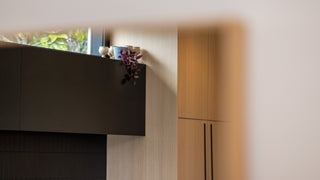 Close-up reflection detail of the Solene X Straight-Edged Full-Length Mirror (170 x 70 cm), showing a clear, undistorted image of a modern interior with oak cabinetry, soft natural lighting, and subtle depth. The mirror features ultra-clear double silver glass that captures fine tonal contrast and true-to-life colour accuracy.