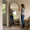 C&F Creation Titan Arched Full Length Mirror 180x80cm in bedroom with person showing scale and full reflection
