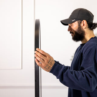 Side profile of the Titan X arched full-length mirror highlighting its ultra-slim black aluminium frame and sturdy 4mm glass construction. The image shows the mirror’s minimalist craftsmanship and refined edge design, reflecting C&F Creation’s focus on modern aesthetics and precision engineering for New Zealand interiors.