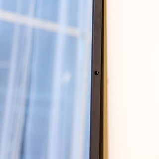 Side profile of the Zenith X mirror showing the 3cm frame depth and clean lines, perfect for leaning display.