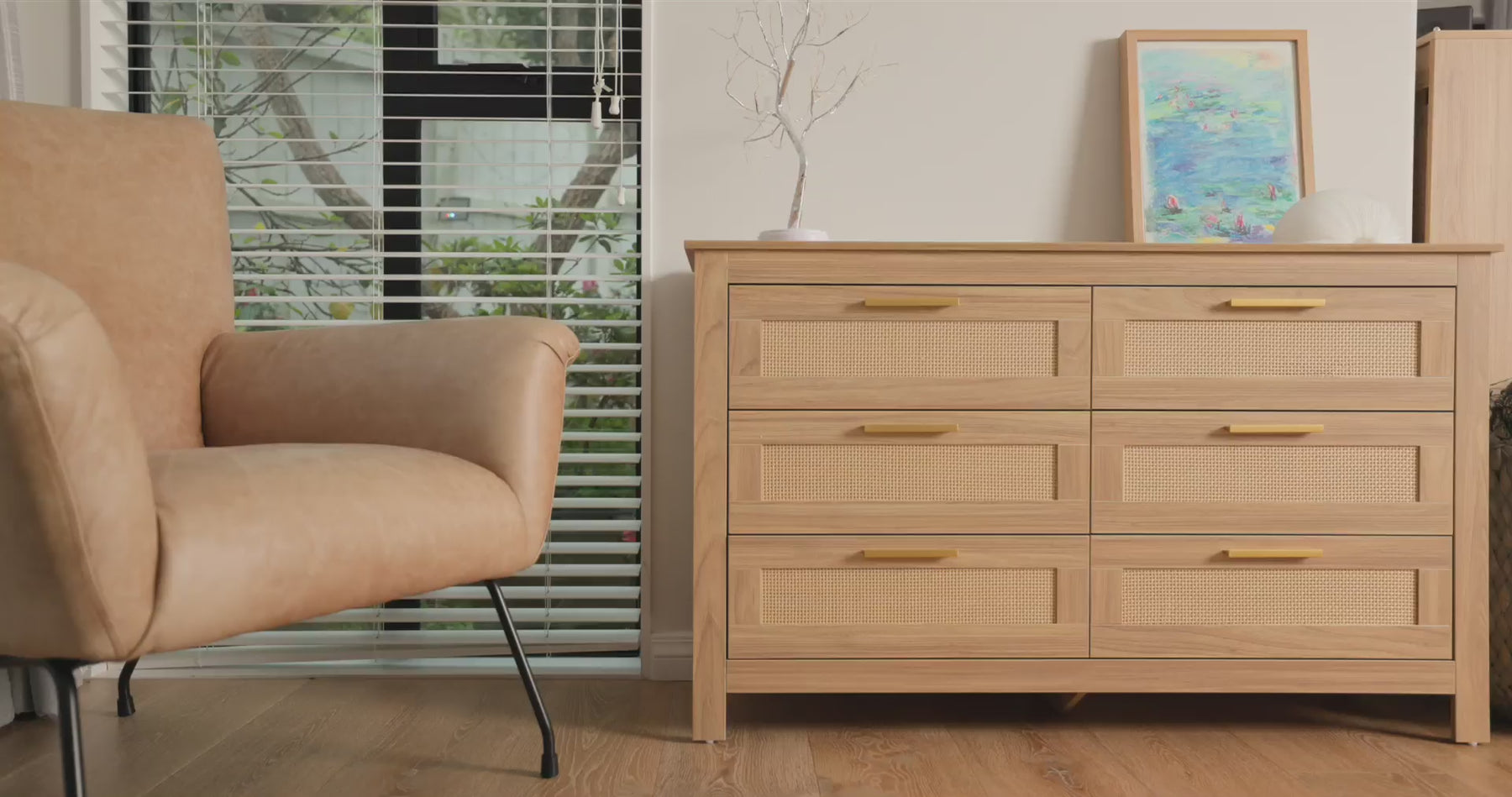 Lifestyle video showcasing the oak-finish six-drawer dresser from C&F Creation’s new furniture collection. The dresser is styled in a modern living room with a beige armchair, decorative artwork, and natural light from large windows. Part of our special new launch promotion featuring five new oak furniture designs.